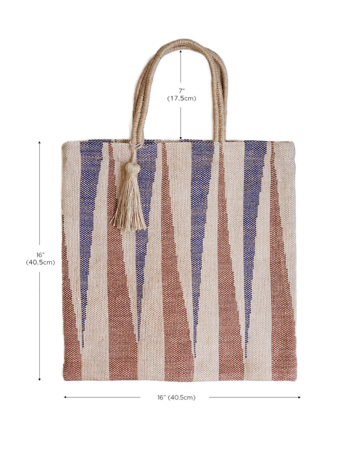 Earthy striped jute tote in rust, navy, and natural with sturdy handles