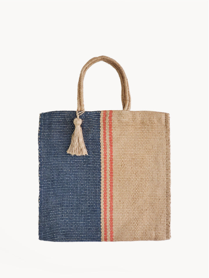 Hand-loomed jute tote bag with color-block design — solid navy and natural beige with red stripes