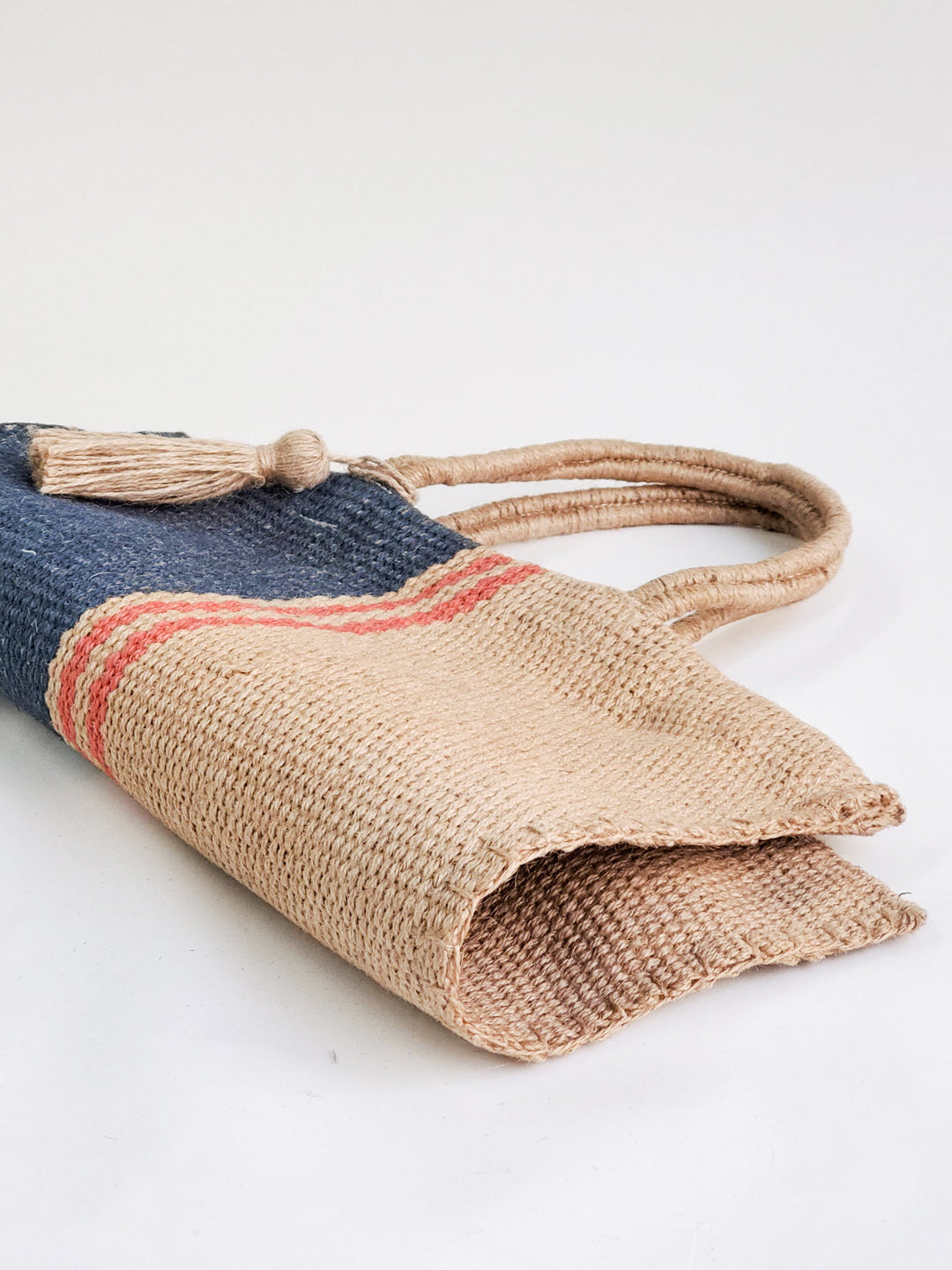 Navy and natural color-block jute tote bag with sturdy handles, hand-loomed in Bangladesh