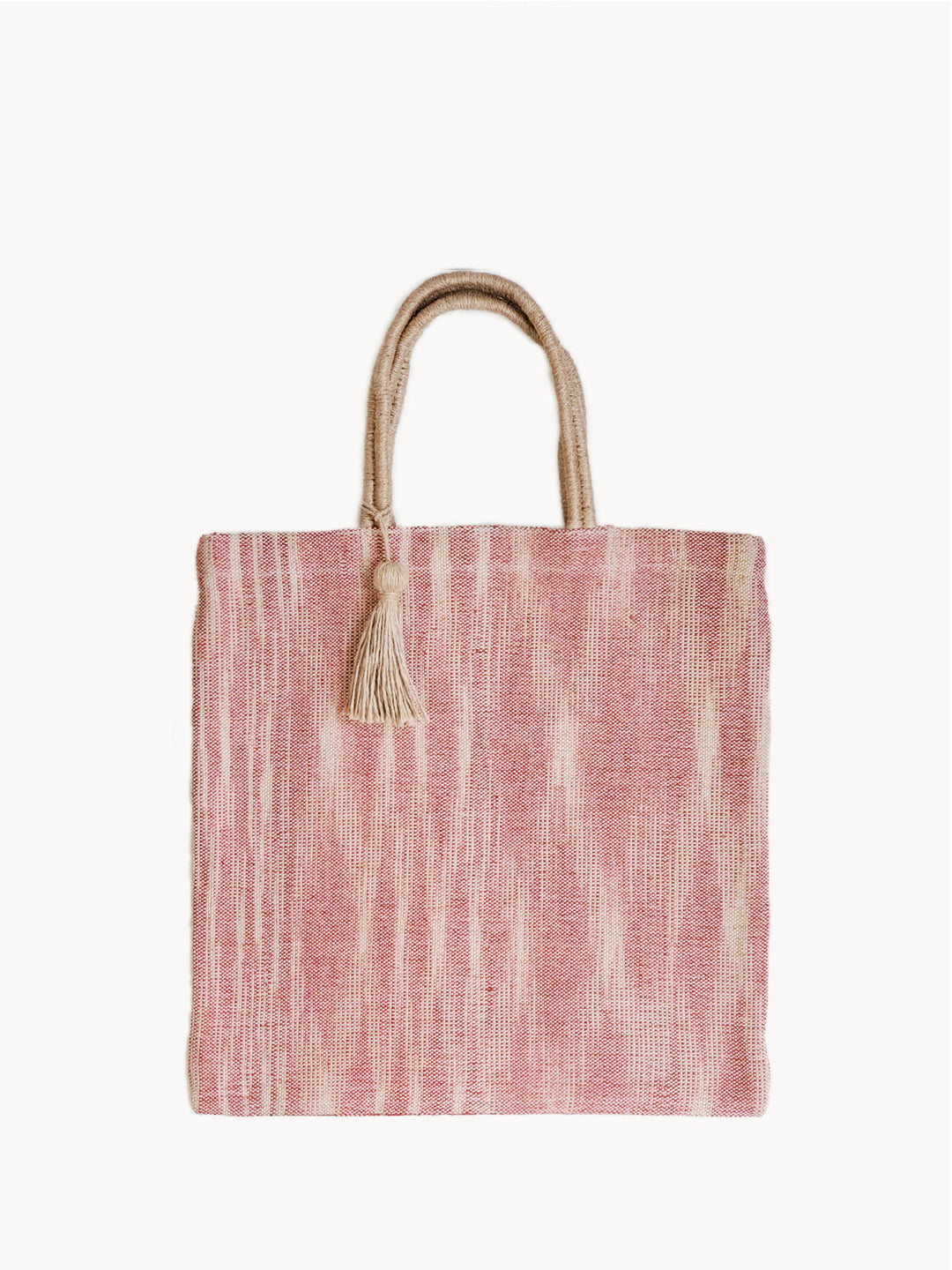 Hand-loomed jute tote with soft painterly red vertical stripes on natural