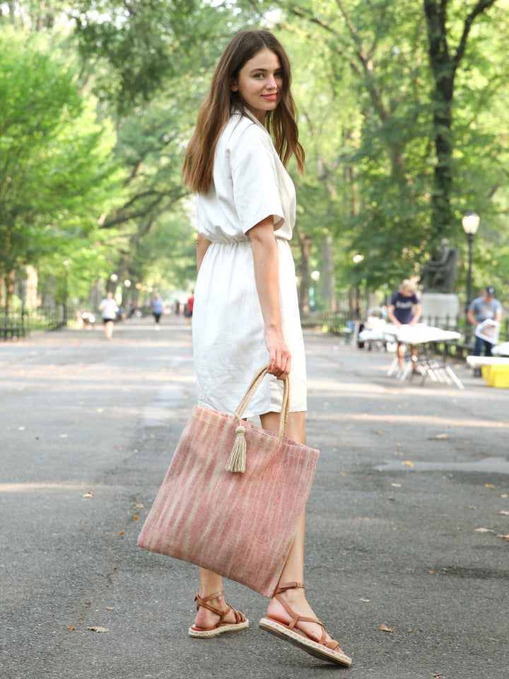 Painterly-stripe jute tote bag in soft red and natural, artisanal pattern