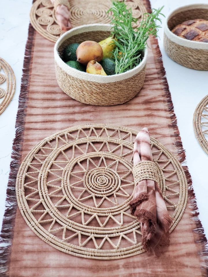 Round natural palm fiber placemats with airy sunburst lattice, set of 2