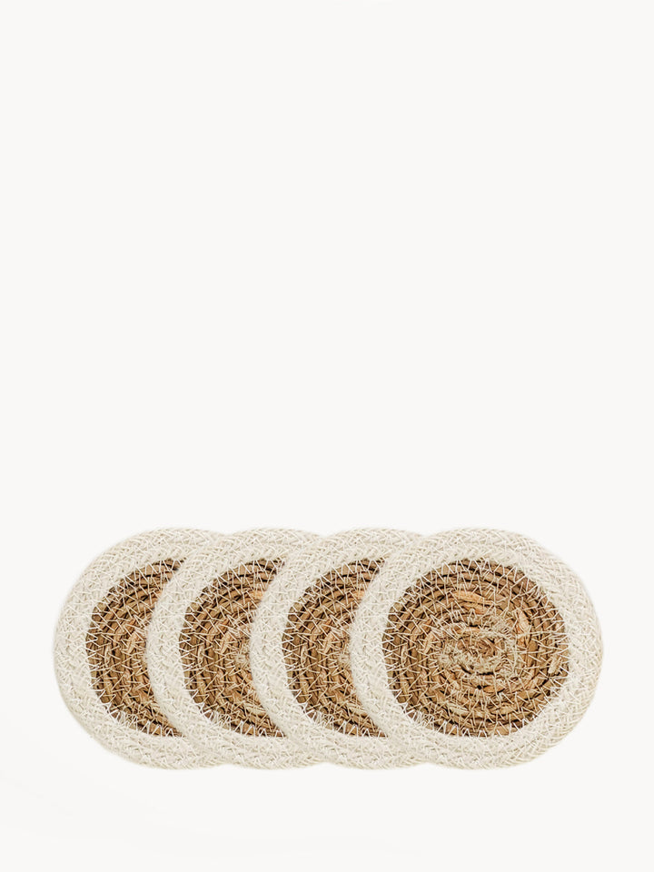 Set of 4 seagrass drink coasters with finely woven center and cream braided rim
