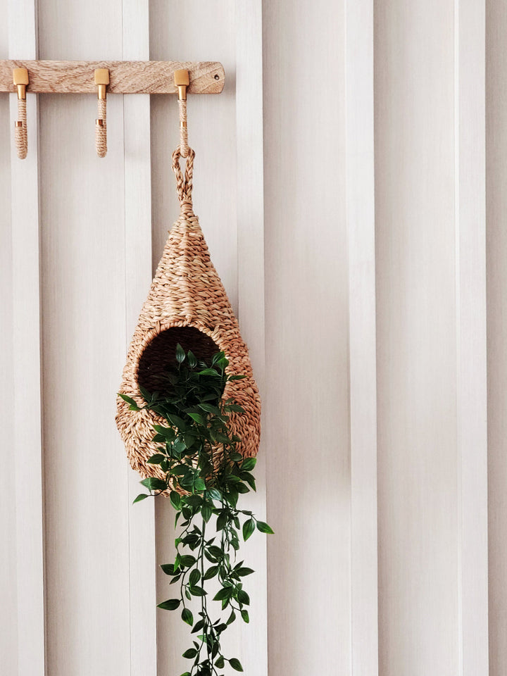 Seagrass woven basket planter by DC-KORISSA, featuring a natural, rustic design for indoor or outdoor plant display