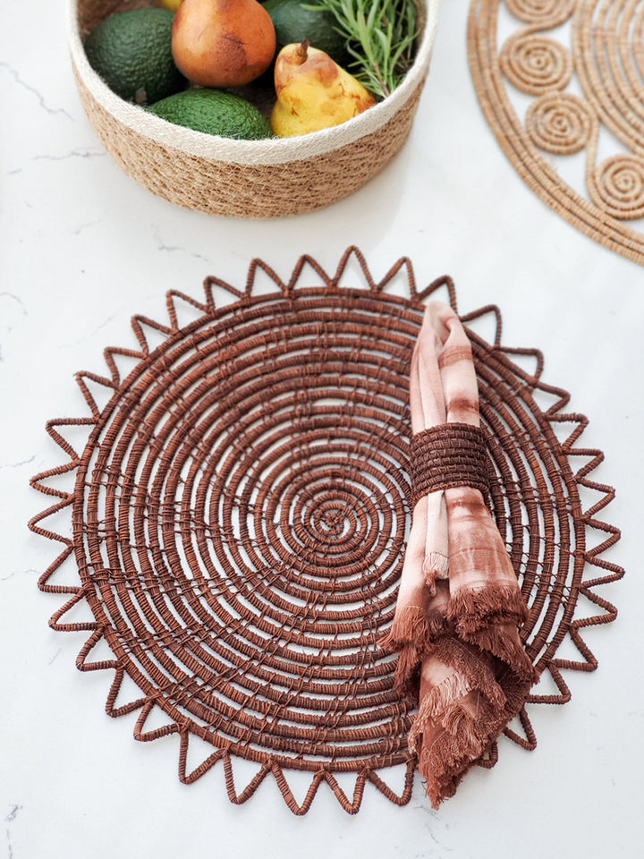 Brown palm fiber placemats with dense concentric spiral pattern, set of 2