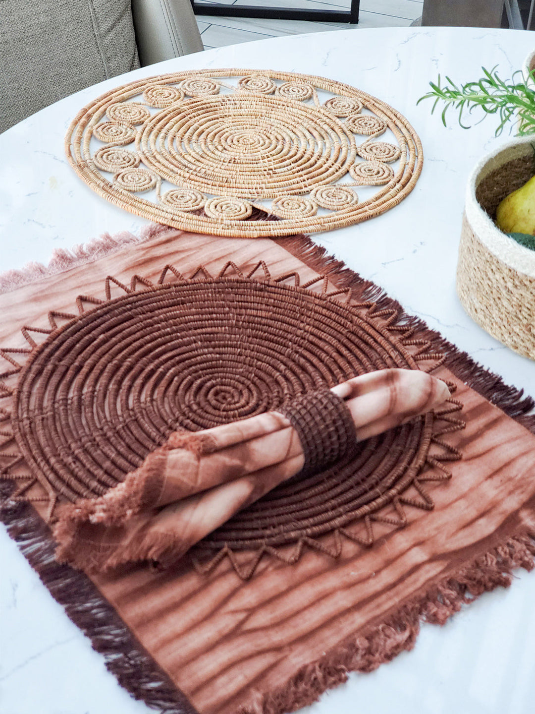 Handwoven brown palm fiber placemats with sawtooth perimeter detail, set of 2