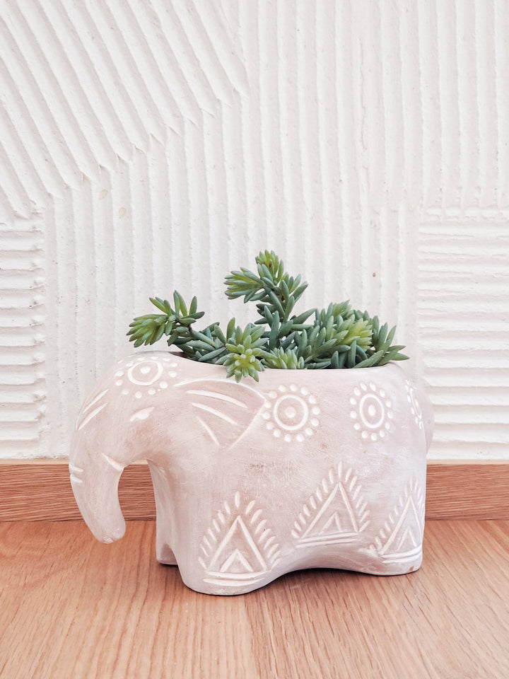Terracotta elephant planter with a decorative folk design for indoor plants