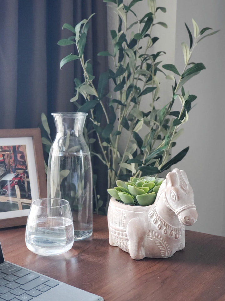 Detailed terracotta horse planter for plant displays