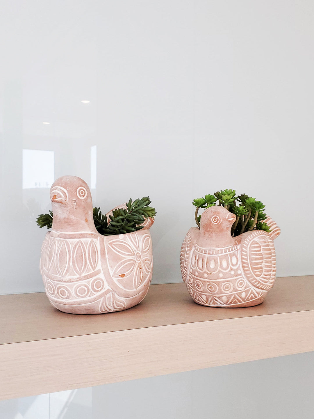 Spotted dove terracotta planter with a black-and-white spotted design