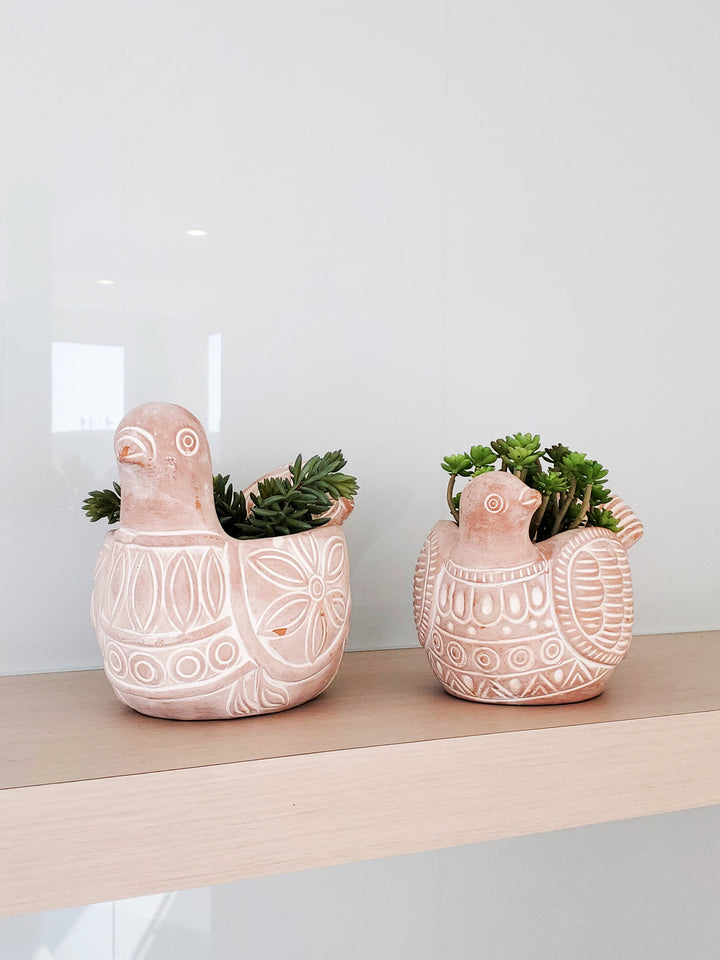Spotted dove terracotta planter with a black-and-white spotted design
