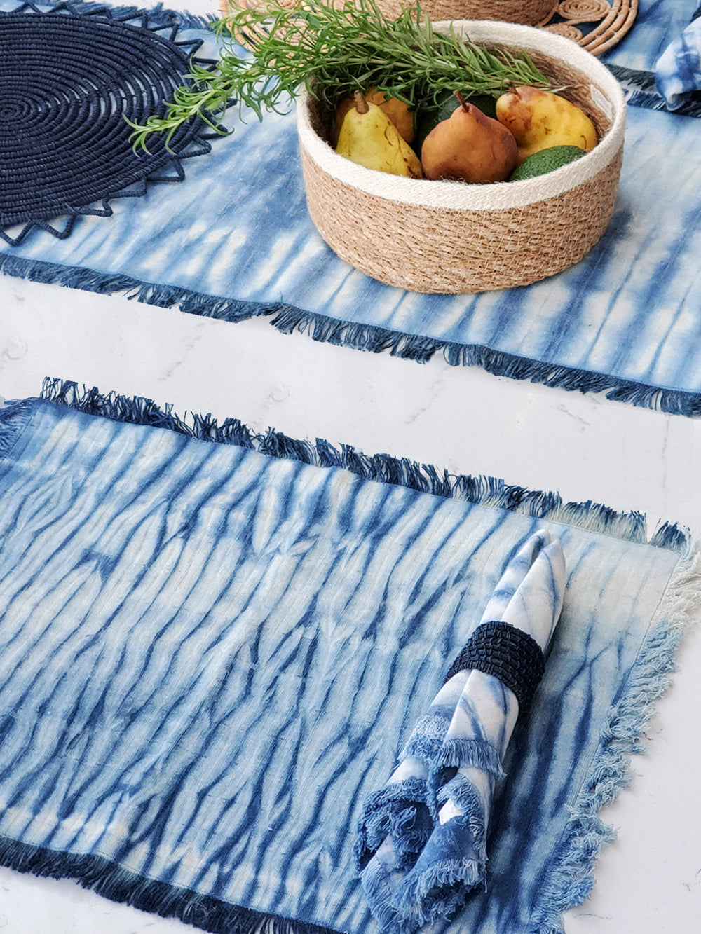 Set of 4 shibori cotton placemats in indigo and white with hand-bound resist pattern