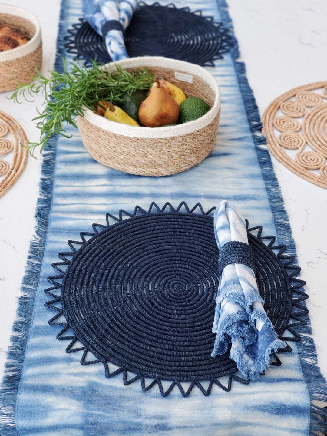 Hand-dyed indigo shibori cotton table runner with geometric resist pattern and fringed edges