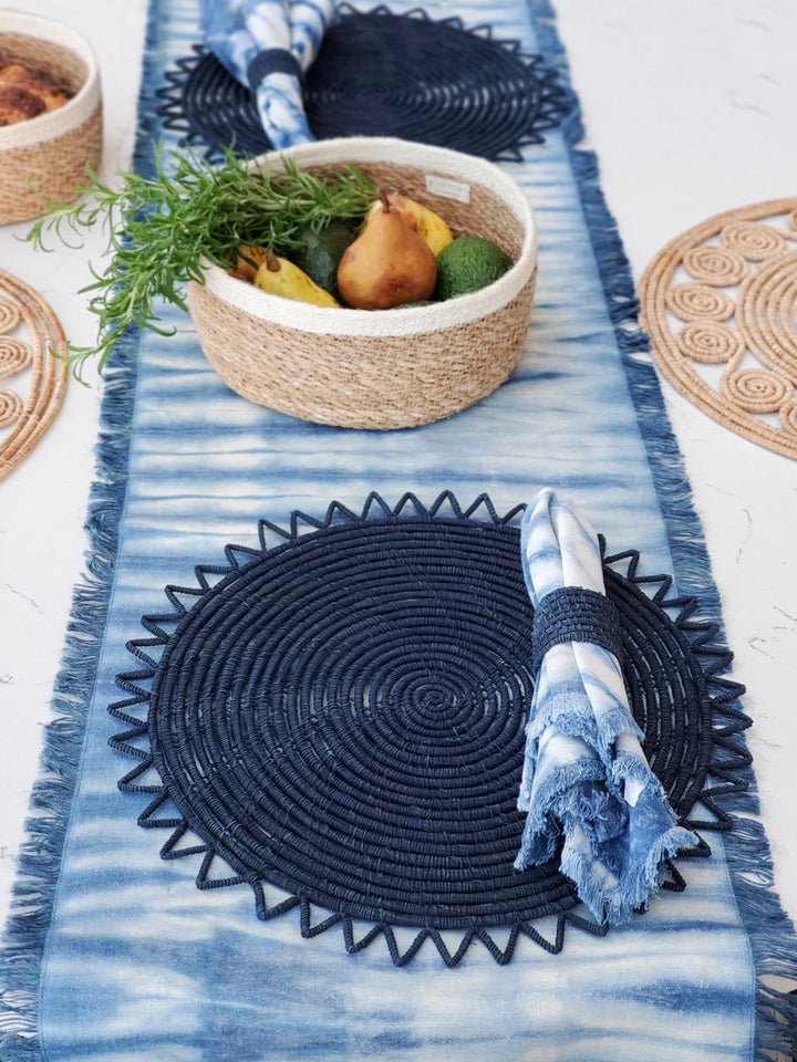 Hand-dyed indigo shibori cotton table runner with geometric resist pattern and fringed edges