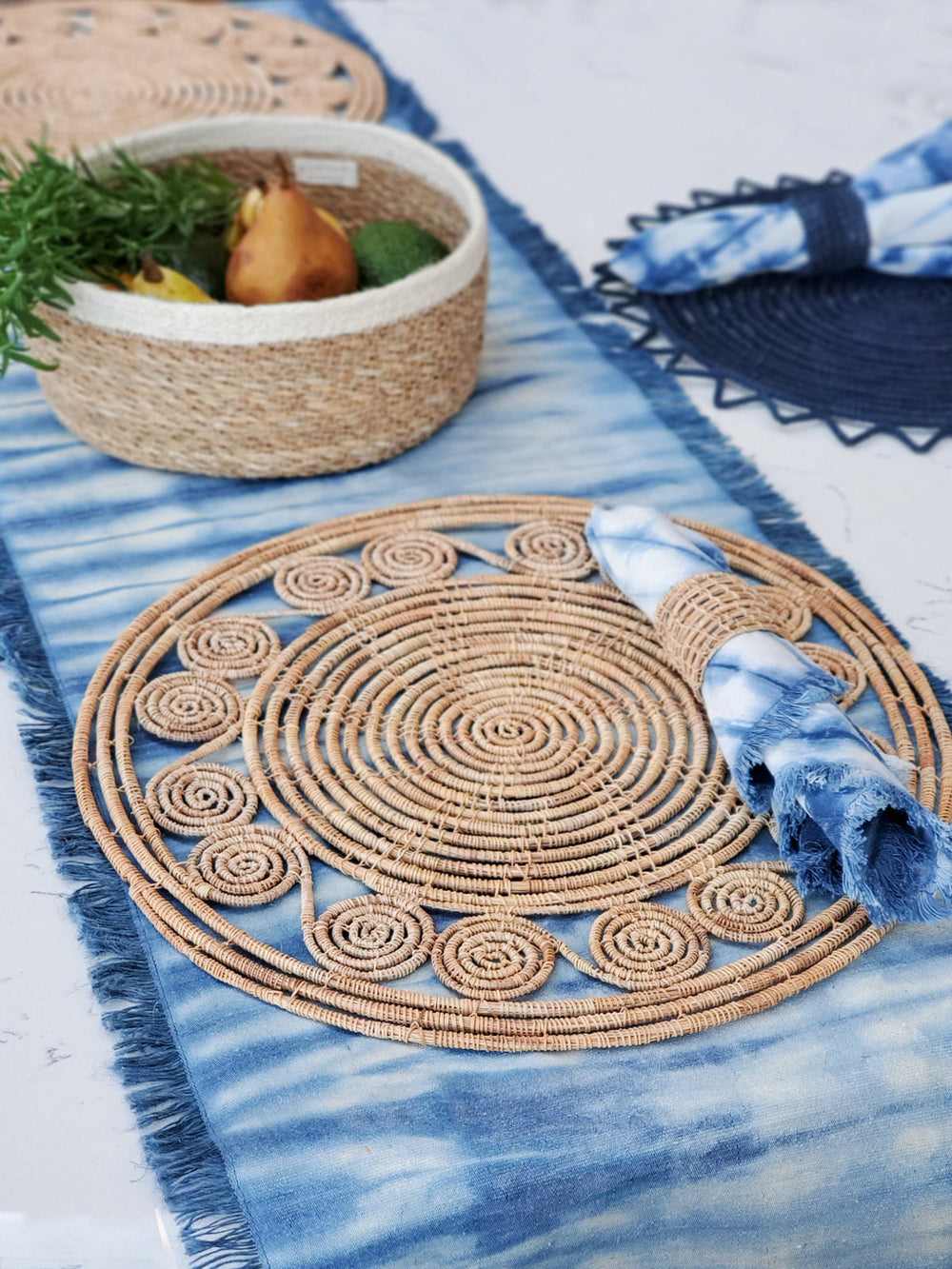Long shibori cotton table runner in indigo blue with bold dye pattern and fringed edges