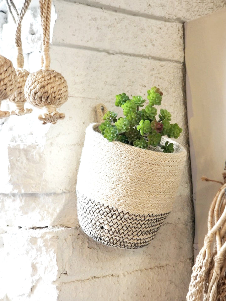 Off-white loop jute storage bin with black stitching