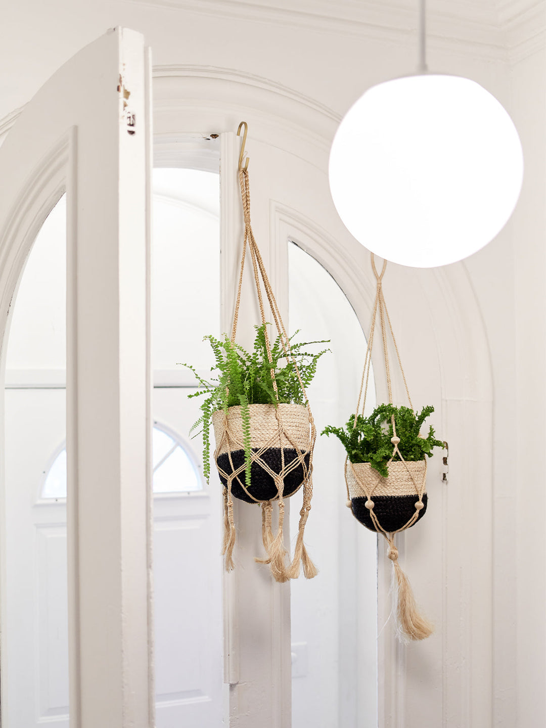 Tasseled macrame plant hanger in natural jute
