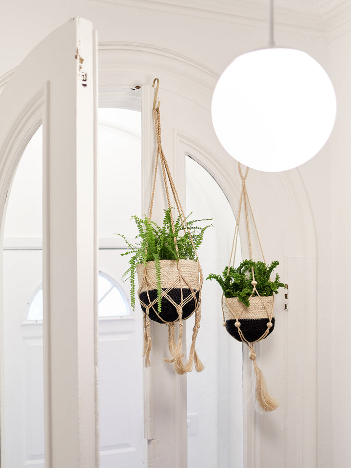 Tasseled macrame plant hanger in natural jute
