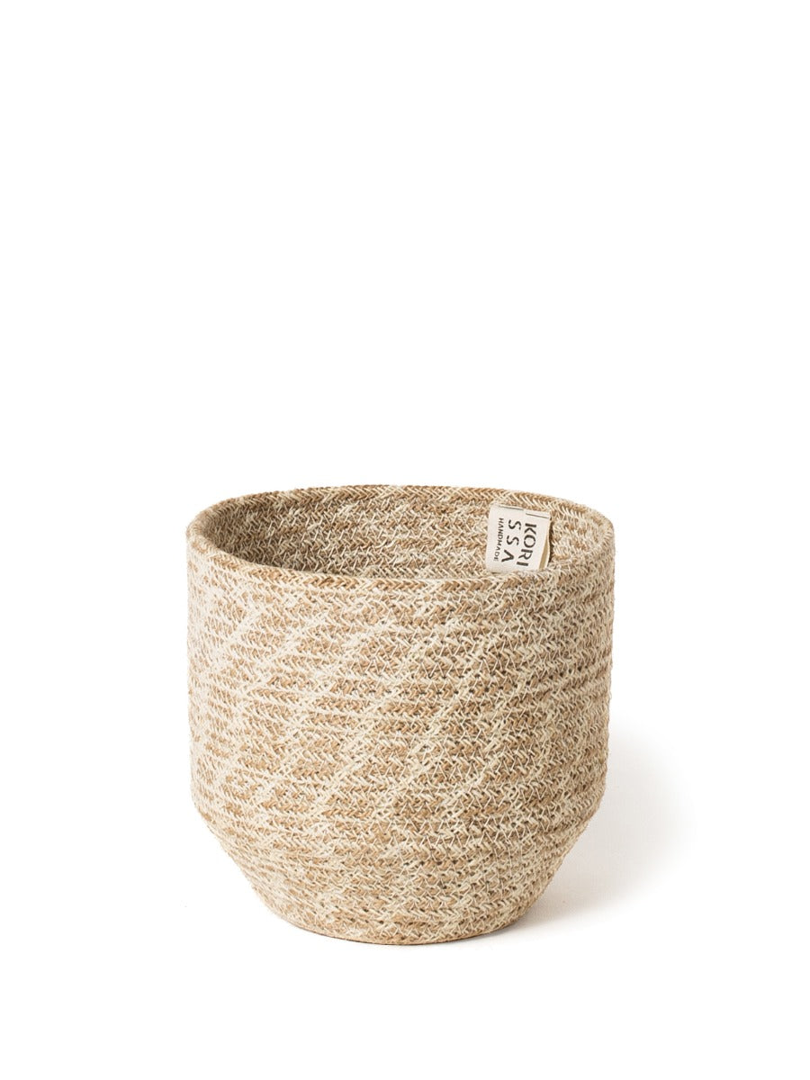 Round handwoven jute storage bin in white and natural