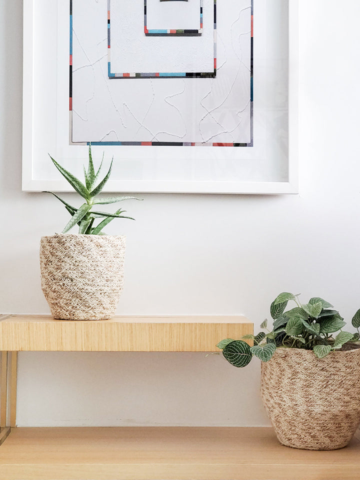 White and natural jute storage bin with a woven texture