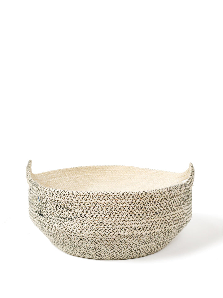 Hand-braided jute fruit bowl in cream with black contrast stitch