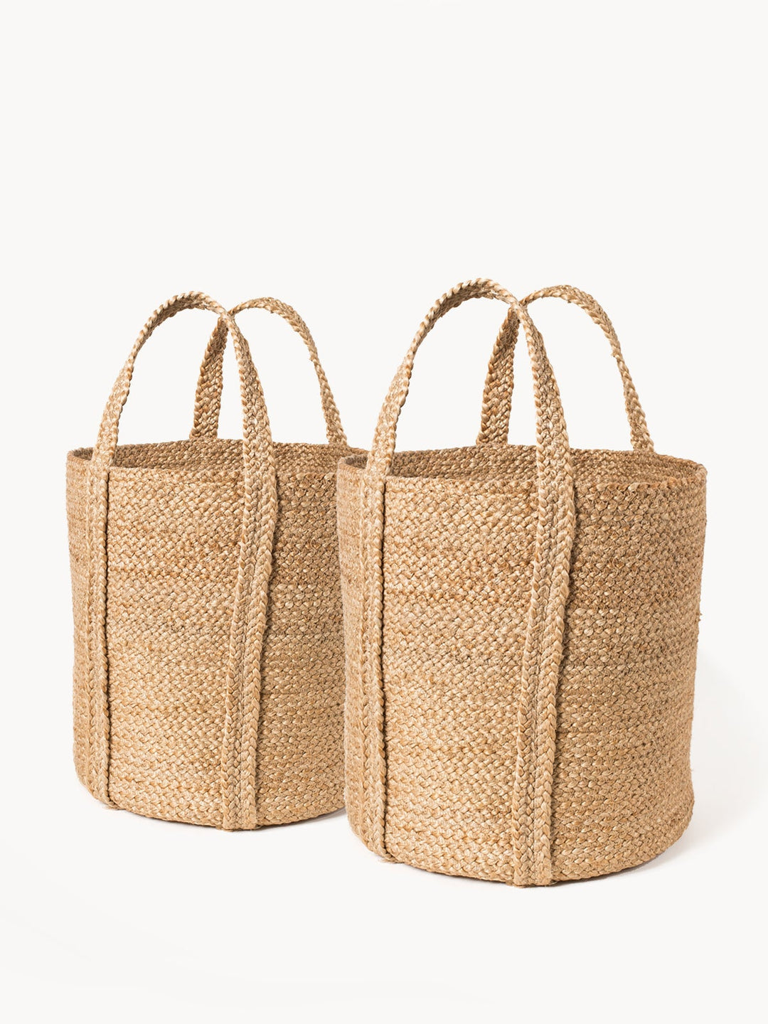 Handwoven jute carry basket with sturdy handles, ideal for living room storage