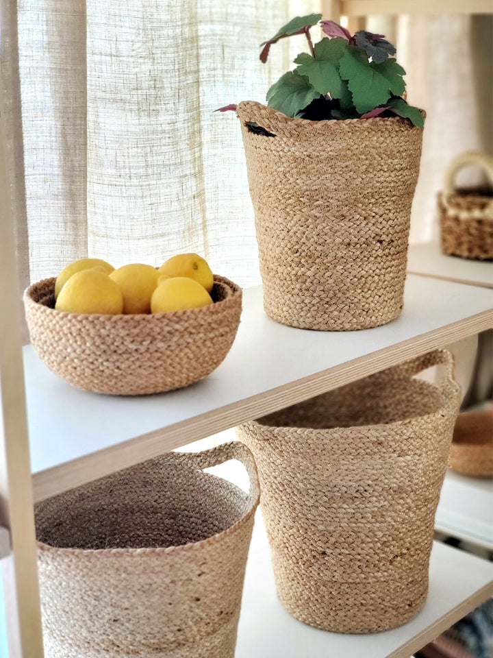 Handwoven jute storage basket with modern cut-in slit handles