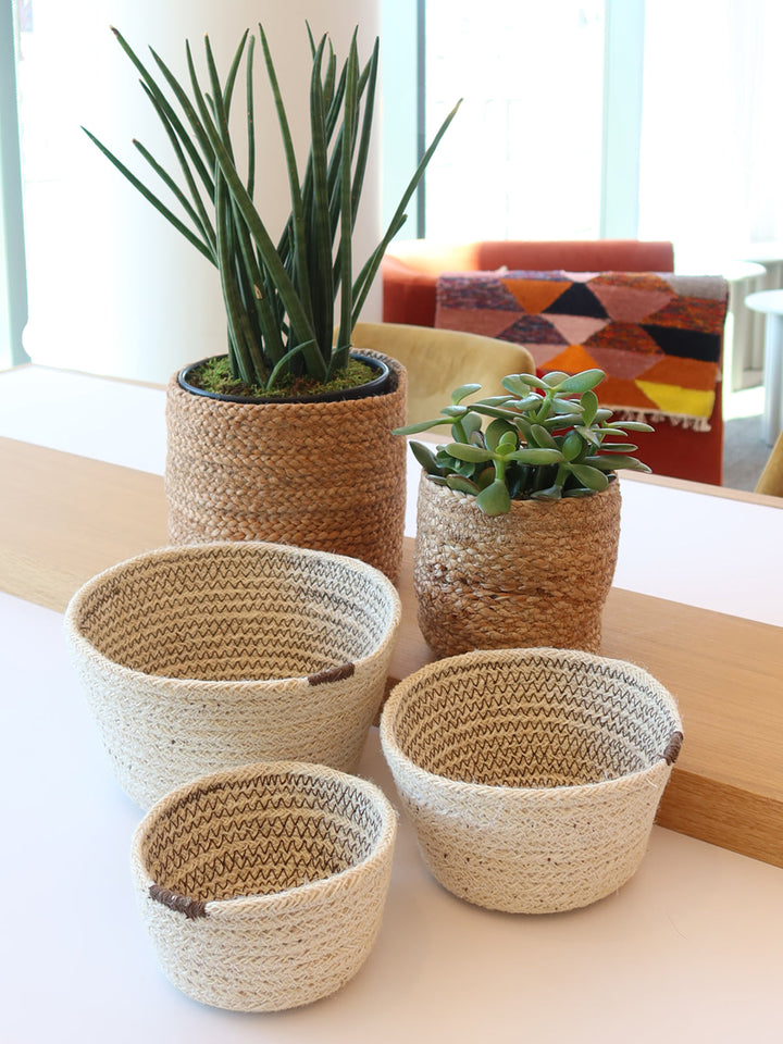 Round handwoven jute baskets with carry handles, available in three sizes