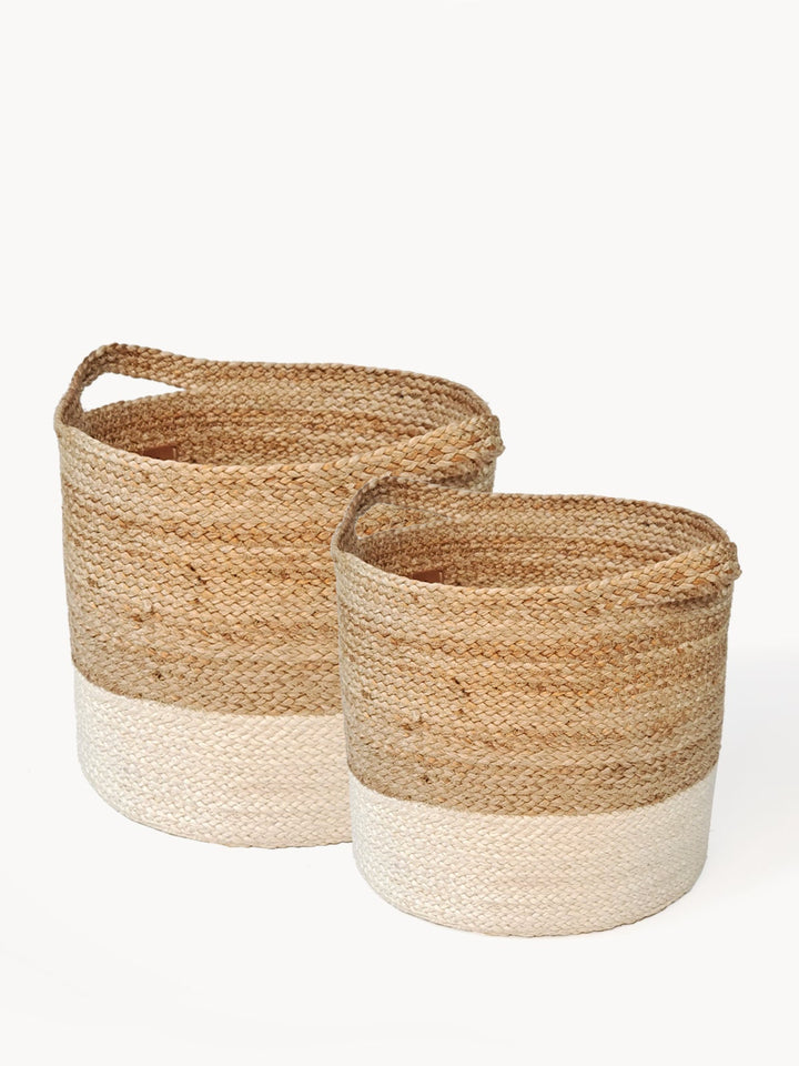 Hand-braided jute basket featuring colorblock styling in natural and white