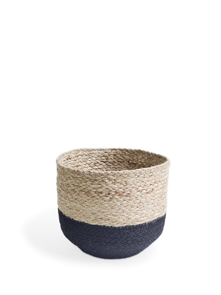 Handwoven natural and black braided jute storage bin with handles