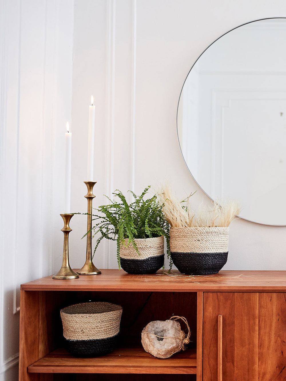 Braided jute storage bin in natural with black trim