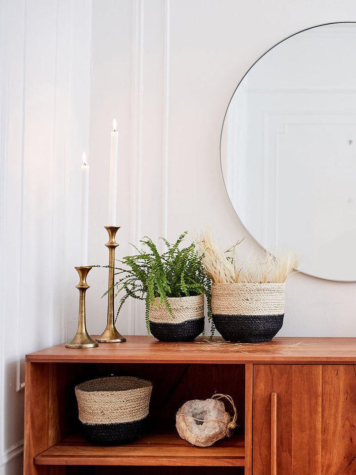 Braided jute storage bin in natural with black trim