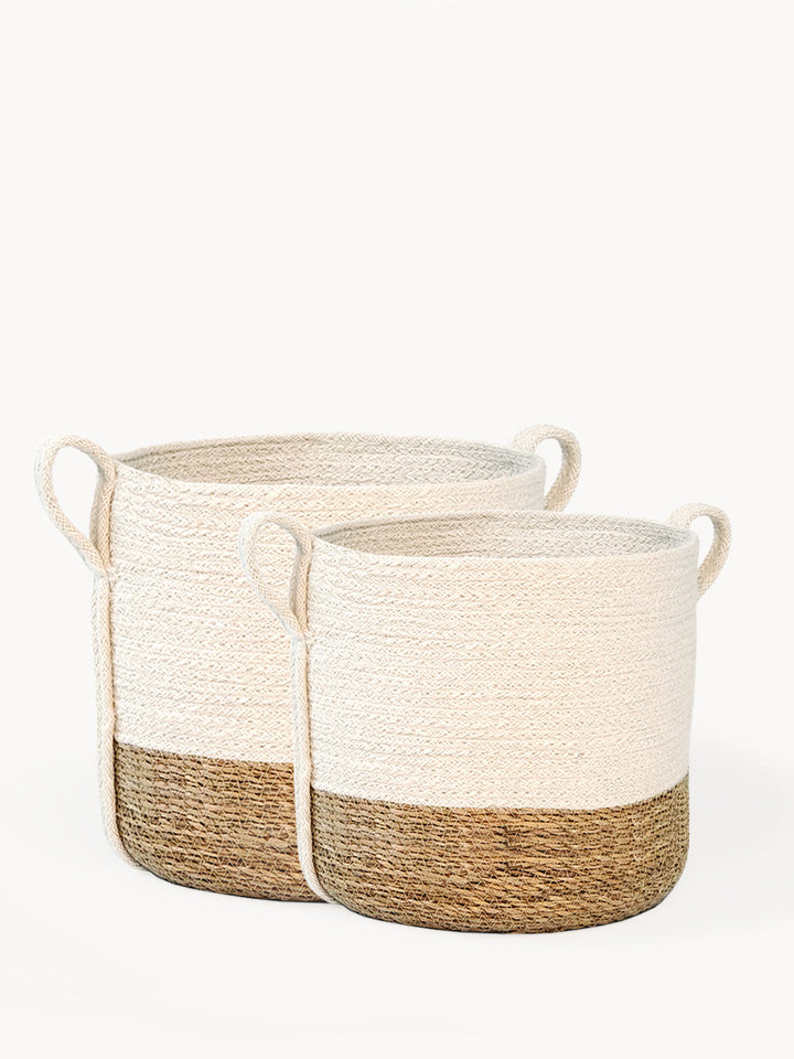 Small natural fiber storage basket with side handle by DC-KORISSA, ideal for organization and decorative storage.