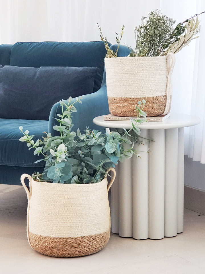 Small natural fiber storage basket with side handle by DC-KORISSA, ideal for organizing small household items.