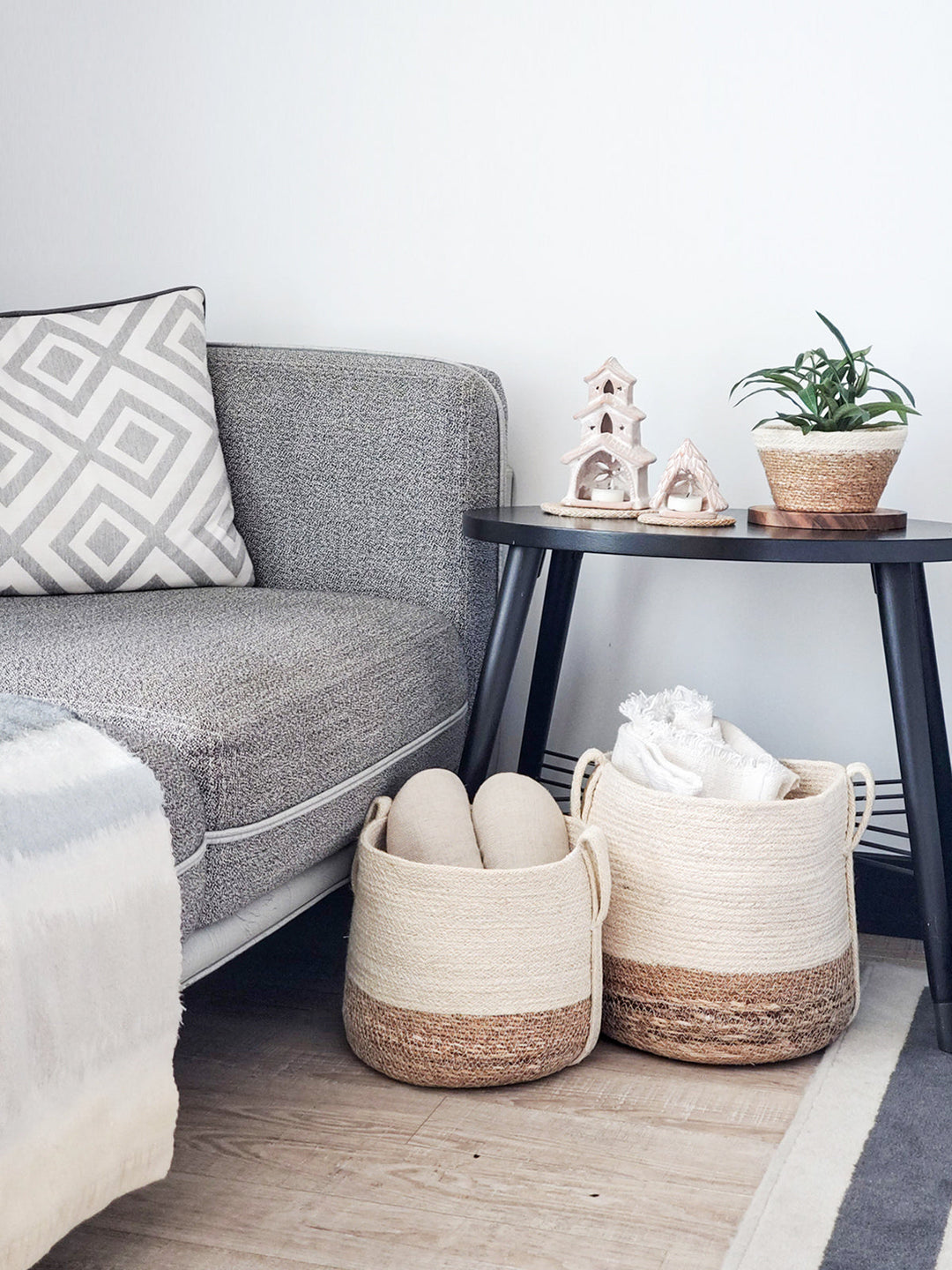 Small DC-KORISSA natural fiber storage basket with side handle, ideal for organizing household items.
