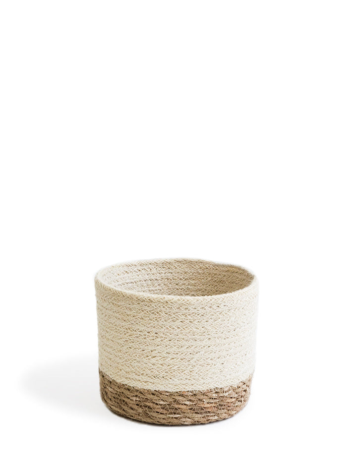 Natural seagrass round storage basket by DC-KORISSA, small size with woven texture, ideal for organizing and decorative storage.