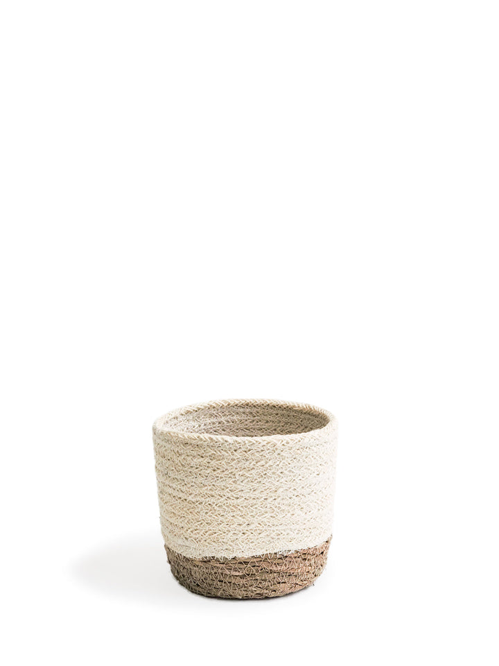 Round natural seagrass storage basket, handwoven with jute accents for organizing