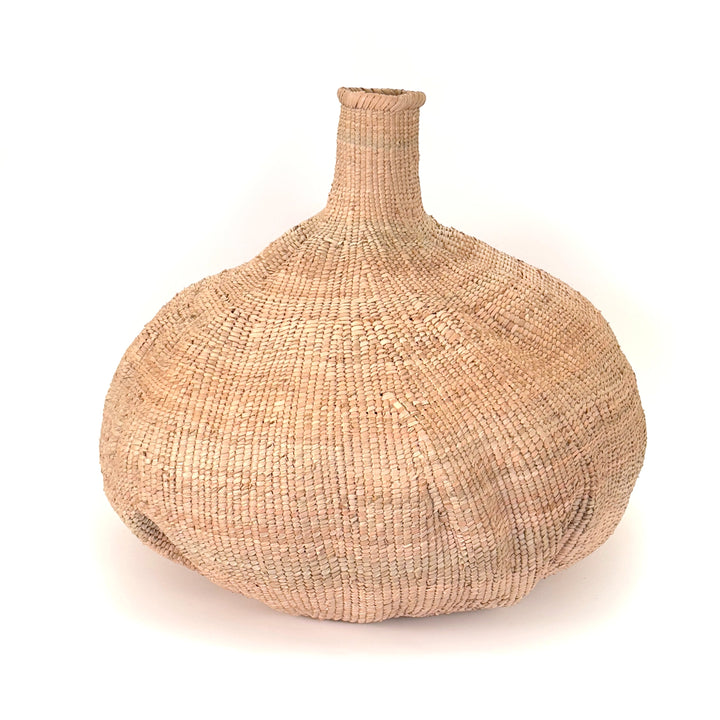 Garlic Tonga basket, handwoven wild Ilala palm with a unique flowing contour, Zimbabwean craft.