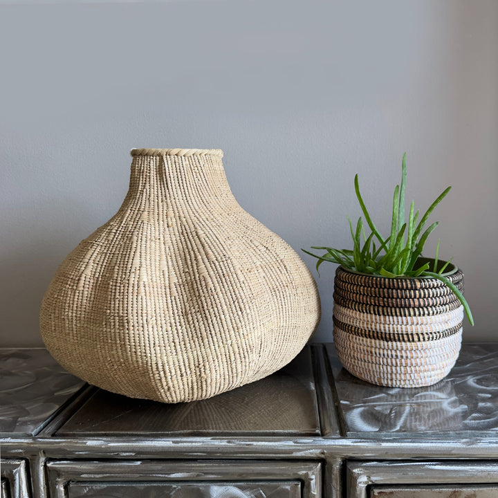Ilala palm Garlic Tonga basket, sculptural floor and shelf decor with a natural woven texture.