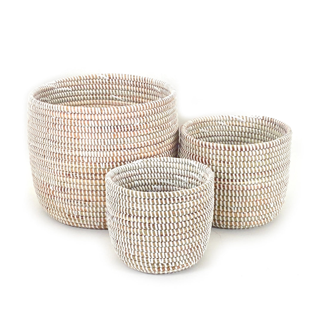 Small white planter basket with a sleek, minimalist woven design.