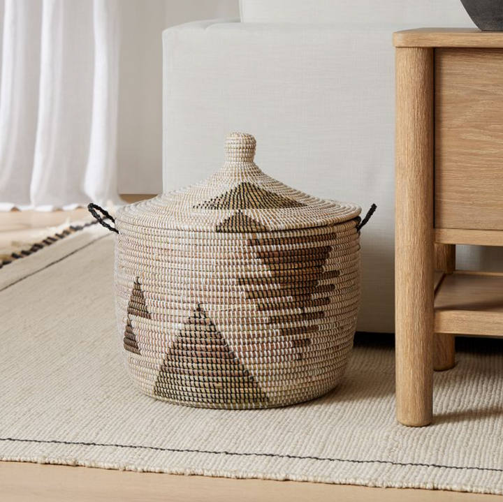 Black and white graphic print floor storage basket, handwoven millet grass from Senegal