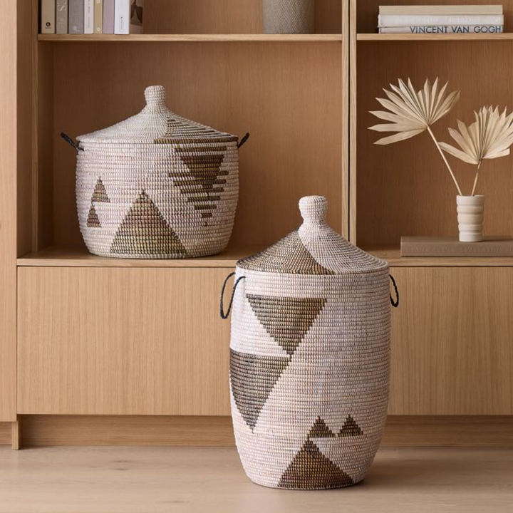 Black and white graphic print floor storage basket with sturdy handles.