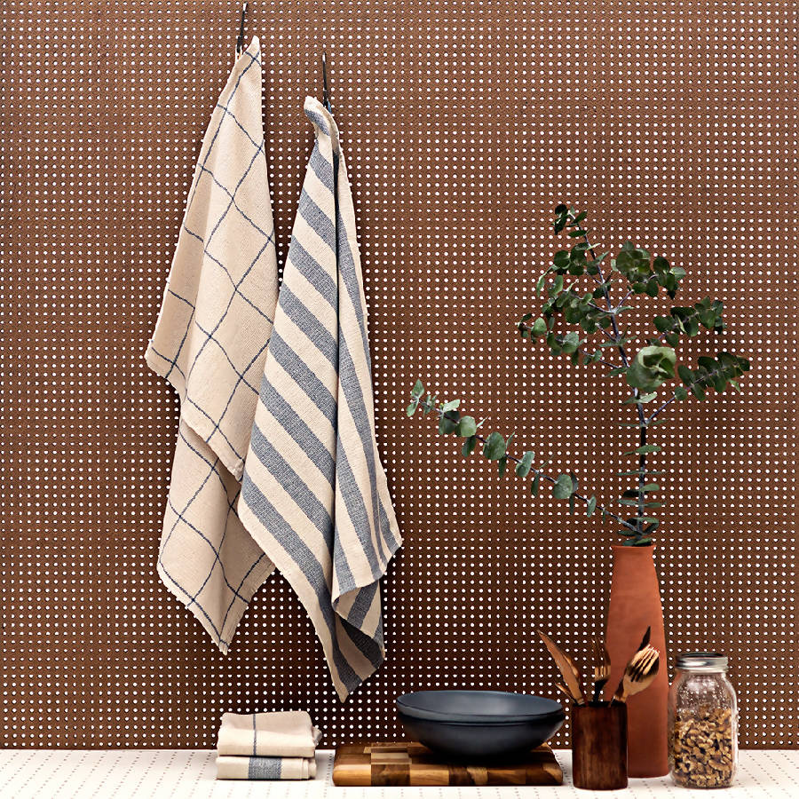 Upcycled cotton kitchen towels with a natural woven texture, ideal for drying glassware.