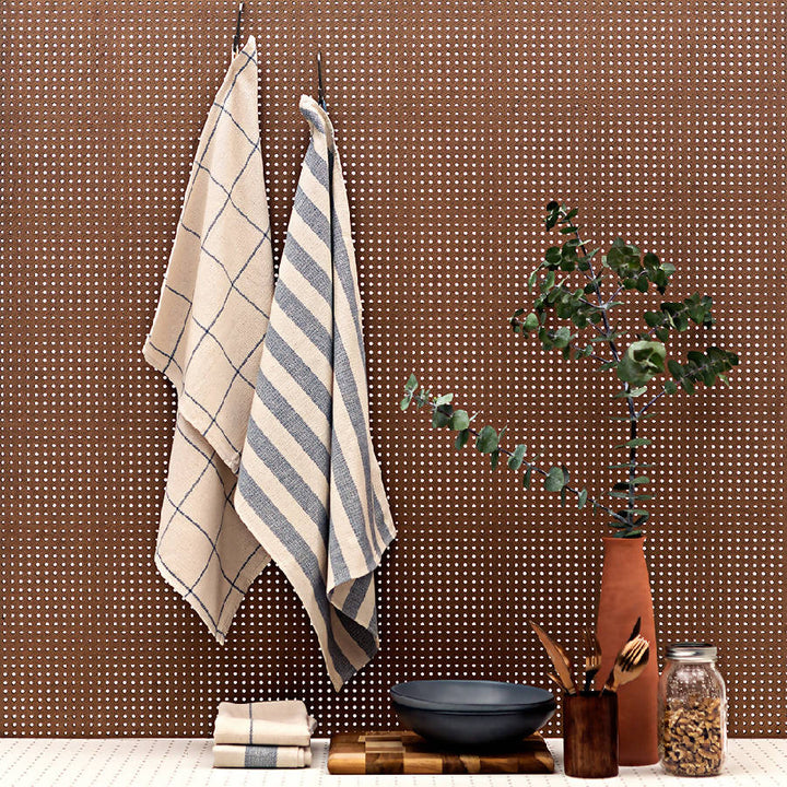 Upcycled cotton kitchen towels with a natural woven texture, ideal for drying glassware.