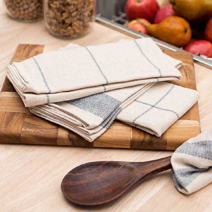 Upcycled cotton kitchen towels in assorted patterns, made from rescued textile scraps.