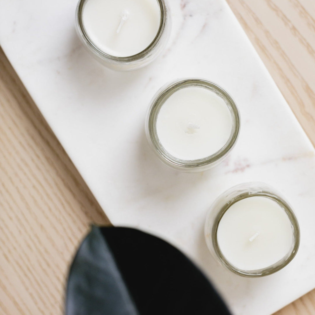 Hammered-glass soy votive candles, set of three, for ambient lighting.