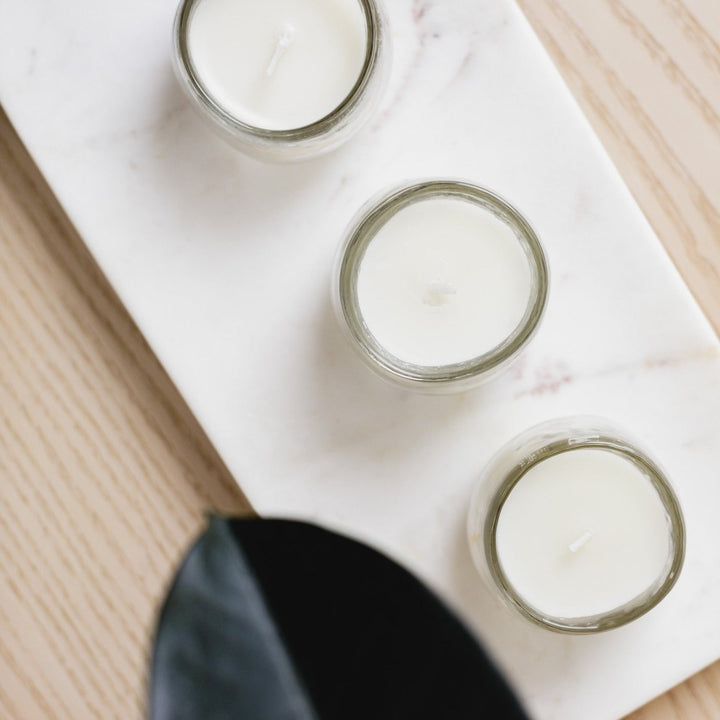 Hammered-glass soy votive candles, set of three, for ambient lighting.