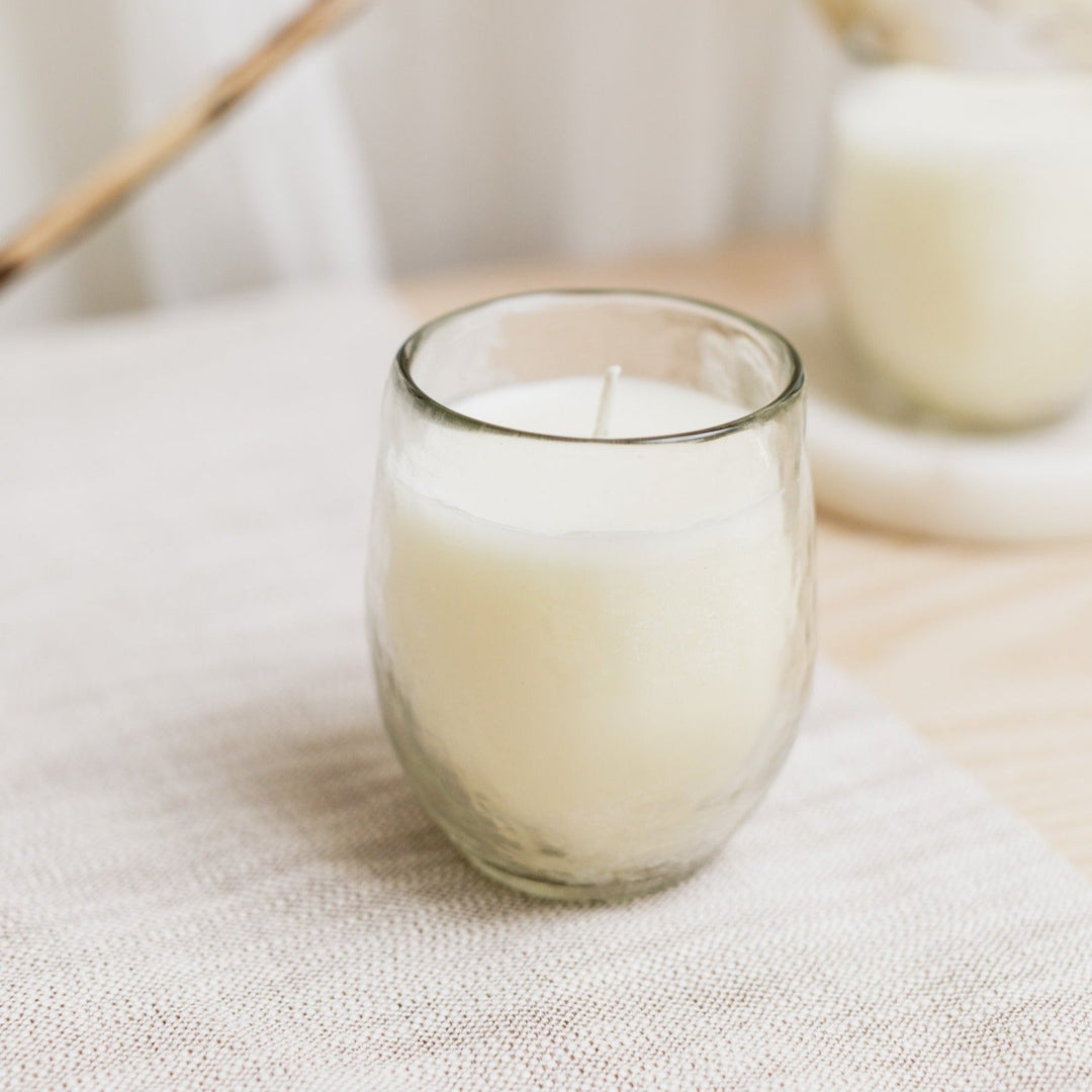 Cozy soy wax votive candle trio in textured hammered glass.