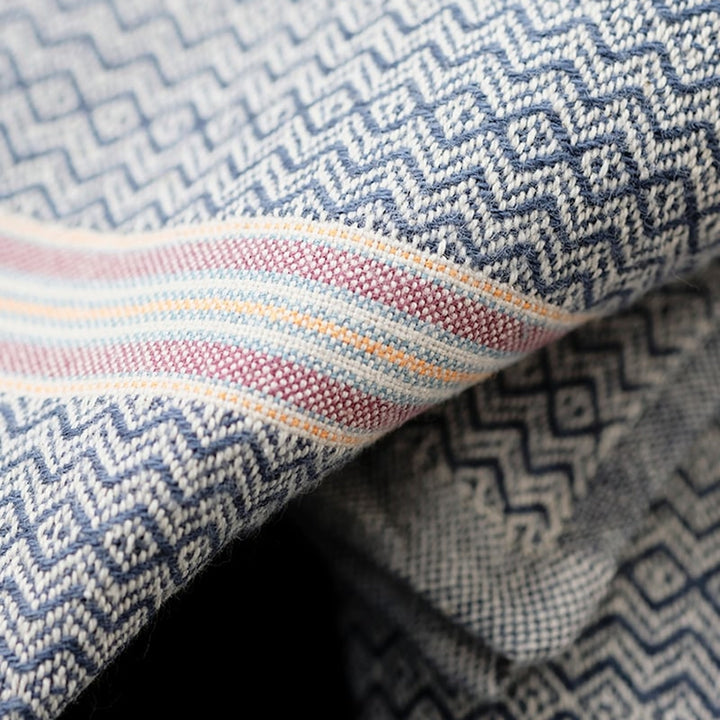 Cardamom cotton dinner napkins showing the woven natural fabric texture.
