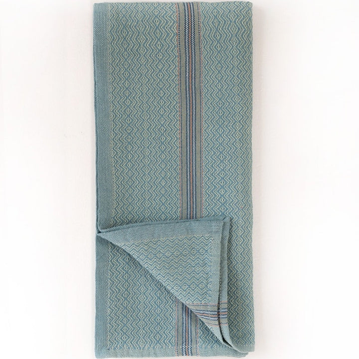 Set of four Mungo cotton dinner napkins in cumin, ginger, mint, and truffle.