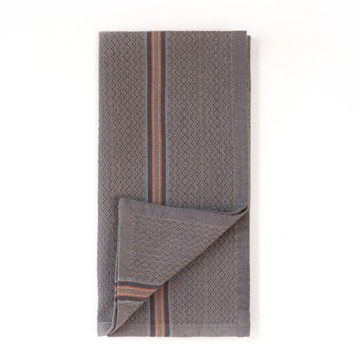 Set of multicolor cotton dinner napkins in four warm earth tones.